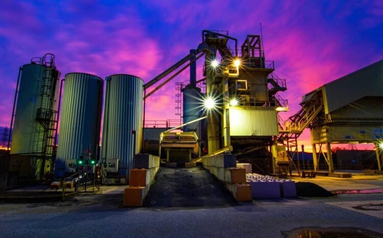 The old cement works with sunrise behind.