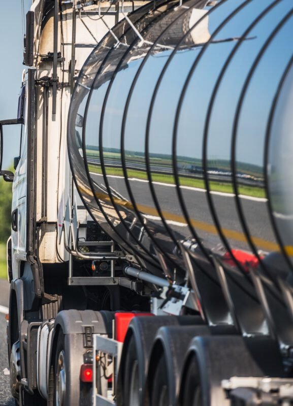 Heavy Transportation Industry. Moving Liquid Shipment. Tank Trailer Semi Truck on a Highway.
